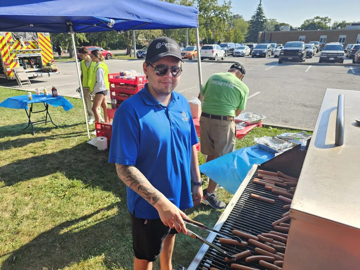 Alex volunteering at a community event